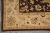 Load image into Gallery viewer, Close-up of a traditional patterned rug corner showing a dark brown field with beige floral motifs and a beige border on a gray floor.