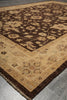 Load image into Gallery viewer, A traditional oriental-style area rug with a dark brown central field and a beige border, laid out on a gray tiled floor.