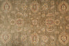 Load image into Gallery viewer, A close-up of a textured area rug featuring a traditional floral and medallion pattern in muted beige, brown, and dusty red tones.