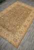 Load image into Gallery viewer, A rectangular area rug with a traditional floral and medallion pattern, shown from an elevated angle on a gray wood-look floor. The rug features a warm beige and tan base with muted green, rust red, and gray accents in the pattern.