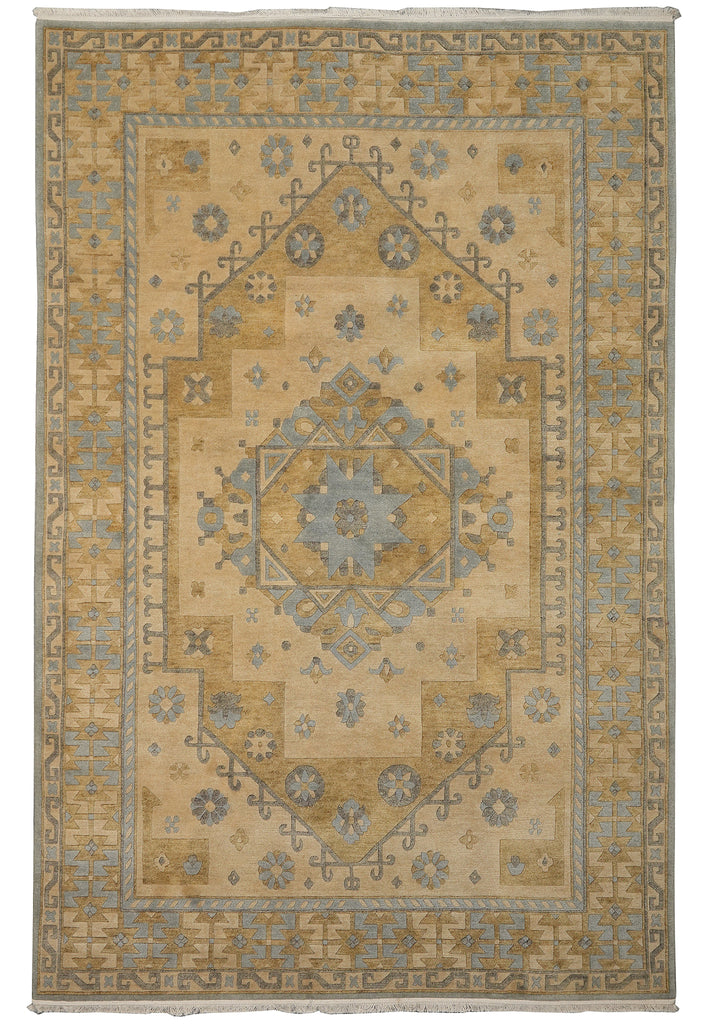A rectangular area rug with a traditional medallion pattern in beige, tan, and muted blue-gray tones, shown flat against a white background.