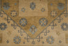 Load image into Gallery viewer, A close-up of a vintage-style patterned rug with a warm tan and beige background, featuring muted blue-gray floral medallions and scrollwork.