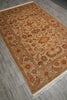 Load image into Gallery viewer, A rectangular traditional area rug with an intricate floral and vine pattern, displayed on a gray wood-look floor. The rug features a warm beige base with rust red, brown, and cream details, complete with white fringe on two short ends.