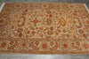 Load image into Gallery viewer, A rectangular area rug with an intricate floral and botanical pattern in warm beige, rust red, and brown tones, laid flat on a gray tiled floor.