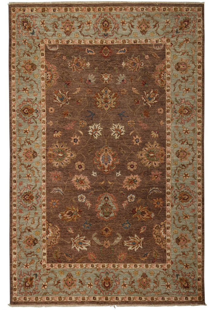 A rectangular traditional area rug with an ornate floral pattern, featuring a dark brown central field, a muted sage green border, and accents of beige, rust, and blue.