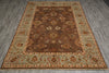 Load image into Gallery viewer, A traditional oriental area rug with a dark brown central field, beige and light blue-green borders, and intricate floral motifs, shown laid out on a gray wood-look floor.