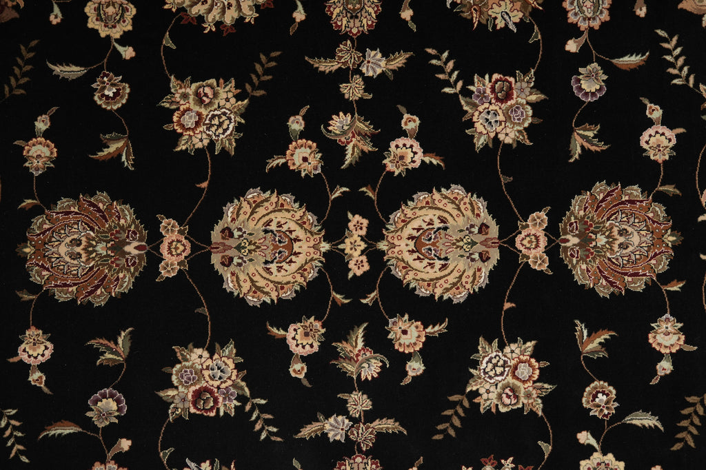 Black fabric featuring an intricate, symmetrical floral and medallion pattern in beige, gold, and muted red tones.