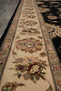 Load image into Gallery viewer, A close-up view of a traditional oriental runner rug with an intricate floral pattern on a beige background, bordered by black and dark patterned sections.