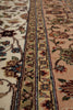 Load image into Gallery viewer, Close-up of an ornate patterned area rug showing floral motifs and detailed borders in beige, cream, pink, green, blue, and brown tones.