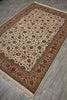 Load image into Gallery viewer, A rectangular traditional area rug with an intricate floral pattern, displayed on a gray wood-look floor. The rug features a cream center, a dusty rose border, and dark brown details.
