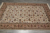 Load image into Gallery viewer, An oriental-style area rug with an intricate floral pattern, laid out on a gray tiled floor. The rug features a cream-colored center field, a dusty rose border, and dark brown and green details throughout the design.