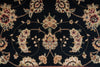 Load image into Gallery viewer, A close-up of a traditional floral patterned rug with cream, beige, and muted red flowers on a very dark navy or near-black background.