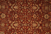 Load image into Gallery viewer, A close-up of an ornate traditional rug with a deep red-brown field, beige floral medallions, and dark blue accents in a repeating geometric and floral pattern.