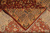 Load image into Gallery viewer, A close-up of a traditional patterned rug with a V-shaped folded corner revealing its detailed design, featuring warm reds, beige, and brown tones with floral motifs.