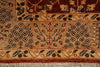 Load image into Gallery viewer, Close-up of a patterned rug showing a beige field with dark brown floral motifs, a central red and green tree-like medallion, and a decorative border with cream fringe.