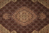 Load image into Gallery viewer, A traditional Persian-style area rug with an intricate floral and geometric pattern in dark brown, beige, and muted pink tones.