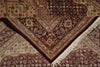 Load image into Gallery viewer, A close-up of an ornate patterned area rug with cream, burgundy, and brown tones, showing detailed floral motifs and white fringe along one corner.