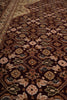 Load image into Gallery viewer, A close-up view of an ornate traditional rug with a dark brown base and intricate floral and geometric patterns in beige, brown, muted green, and cream.