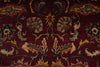 Load image into Gallery viewer, A close-up of an ornate traditional rug with a deep burgundy red field, featuring symmetrical floral and bird motifs in beige, gold, and muted blue-green.