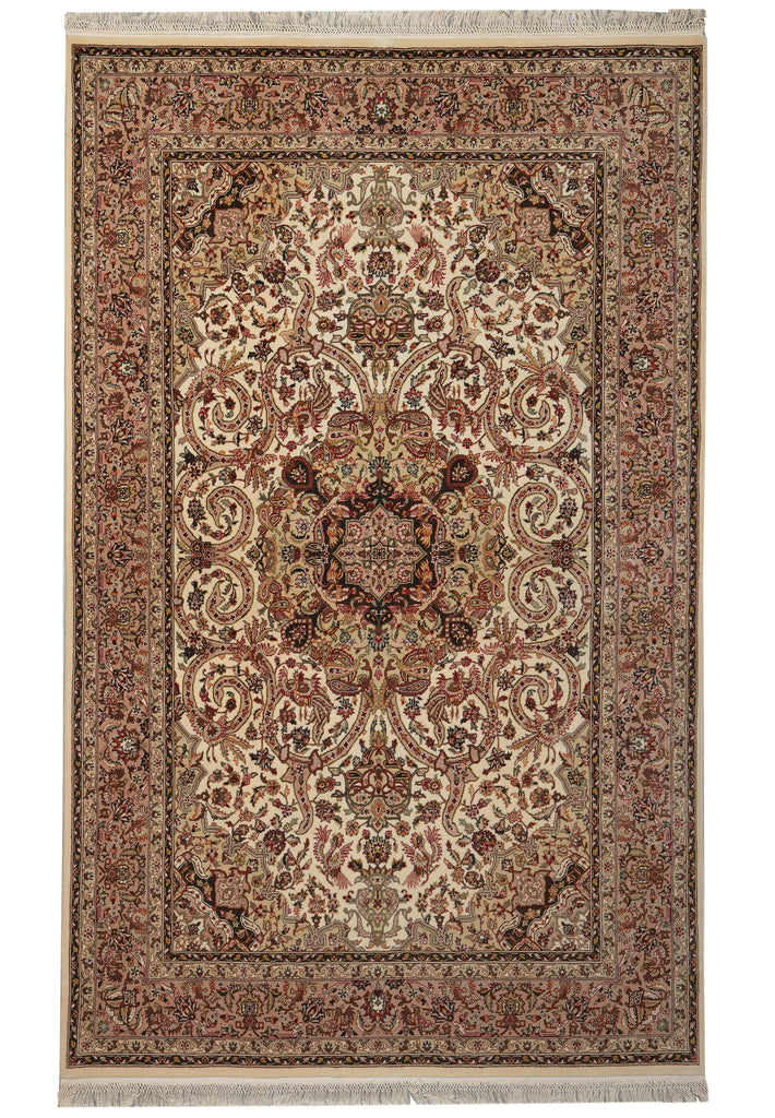A traditional oriental-style area rug with an intricate floral and scroll pattern, featuring a central medallion, detailed borders, and fringed edges on a white background.