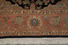 Load image into Gallery viewer, Close-up of an ornate patterned rug showing a terracotta field, cream and blue floral motifs, a dark navy border, and white fringe tassels.