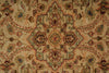 Load image into Gallery viewer, A close-up of a traditional patterned rug with a central medallion and floral motifs in beige, brown, muted green, and dusty blue.
