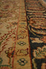 Load image into Gallery viewer, Close-up of an ornate patterned area rug with beige, navy, red, and green woven detailing.