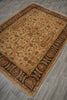 Load image into Gallery viewer, A rectangular traditional area rug with an intricate floral and medallion pattern, shown from an elevated angle on a gray wood-look floor. The rug features a warm beige center field, dark brown borders, and accents of rust red, green, and blue in the detailed pattern.