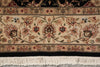 Load image into Gallery viewer, Close-up of an ornate patterned rug with cream, beige, pink, and brown floral motifs, bordered by black bands and white fringe at the bottom.