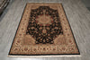 Load image into Gallery viewer, A rectangular area rug with an intricate traditional floral pattern, featuring a black center, beige borders, and red accents, laid out on a gray wood-look floor.