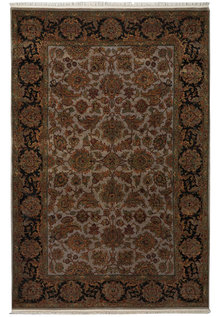A traditional oriental area rug with an intricate floral and geometric pattern, featuring a central field and ornate borders in shades of brown, beige, and black.
