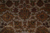 Load image into Gallery viewer, A close-up of an ornate traditional patterned rug with a central floral medallion and repeating motifs in muted brown, rust orange, olive green, and beige tones.