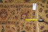 Load image into Gallery viewer, A close-up of a patterned area rug with a beige base and multicolor floral motifs, shown with a yellow tape measure and a white size tag to indicate dimensions.