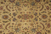 Load image into Gallery viewer, A close-up of an ornate patterned textile or rug with a warm beige/tan base and intricate floral, paisley, and medallion motifs in muted blue, rust red, and brown tones.