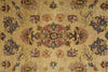 Load image into Gallery viewer, A close-up of a traditional patterned rug with a warm beige background and ornate floral motifs in muted blue, pink, green, and orange.