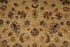 Load image into Gallery viewer, A close-up of a woven rug with a floral and vine pattern on a warm golden-beige background. The design features muted brown, green, and cream motifs throughout.