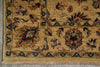 Load image into Gallery viewer, Close-up of a traditional patterned rug corner showing a beige and gold field with floral motifs in brown, green, and rust tones, plus a fringed edge.
