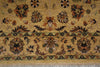 Load image into Gallery viewer, A close-up of a traditional patterned rug with a warm beige background and intricate floral motifs in brown, green, and black.