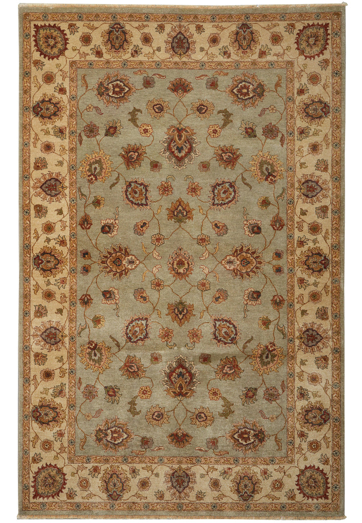 A traditional oriental-style area rug with an intricate floral and medallion pattern, featuring a muted sage green center field, beige borders, and rust-brown accents.