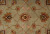 Load image into Gallery viewer, A close-up of a traditional patterned rug with a muted sage green background and floral motifs in brown, rust, beige, and dark accents.