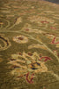 Load image into Gallery viewer, Close-up of a textured area rug with an intricate floral and vine pattern in olive green, beige, and muted red.