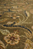 Load image into Gallery viewer, Close-up of a traditional patterned area rug with a muted olive green base, featuring cream, beige, and navy floral and scroll motifs.