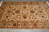 Load image into Gallery viewer, An ornate rectangular area rug with a traditional floral and medallion pattern, featuring a beige background with brown, green, and rust-red motifs, laid out on a gray tiled floor.