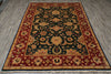 Load image into Gallery viewer, A traditional oriental area rug with an intricate floral pattern, featuring a dark green center, red borders, and beige accents, laid out on a gray wood-look floor.