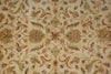 Load image into Gallery viewer, A close-up of an ornate floral patterned rug or textile in warm beige, with cream, muted green, rust red, and brown detailing.