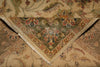 Load image into Gallery viewer, A close-up of a traditional oriental-style rug corner, showing a beige and olive green base with floral motifs in muted red, blue, and brown tones, with a fringed edge visible.