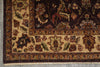 Load image into Gallery viewer, Close-up of a traditional patterned rug corner showing a dark brown field, beige border, and floral motifs in rust, green, and cream.