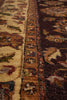 Load image into Gallery viewer, Close-up of a traditional patterned area rug showing detailed woven motifs in beige, brown, and dark red tones.