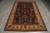 Load image into Gallery viewer, A rectangular traditional area rug with an intricate floral pattern, featuring a dark brown center, beige borders, and red accents, laid out on a gray wood-look floor.