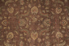 Load image into Gallery viewer, A close-up of a brown patterned rug or textile with an ornate floral and paisley design in beige, muted green, and small red accents.